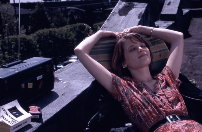 Janet (Bridget Fonda) relaxes in the sun