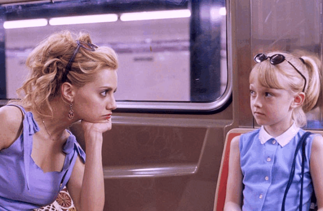 Molly and Ray look at each other on the train