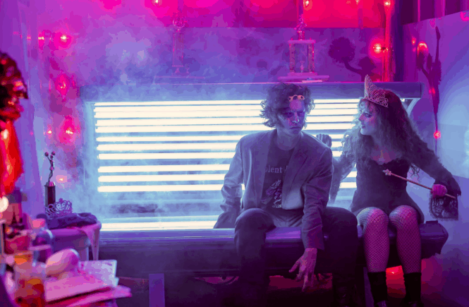 Lisa regards The Creature after zapping him in the tanning bed